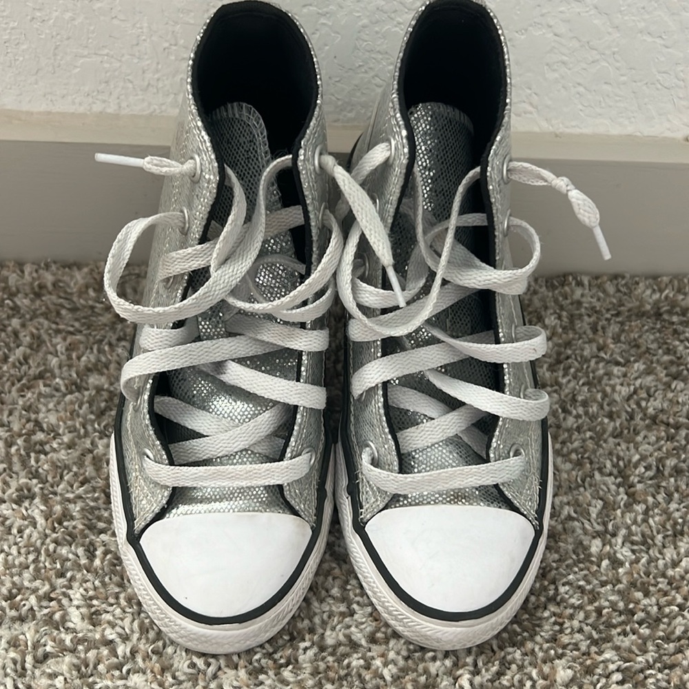 Girls silver Chuck Taylor’s